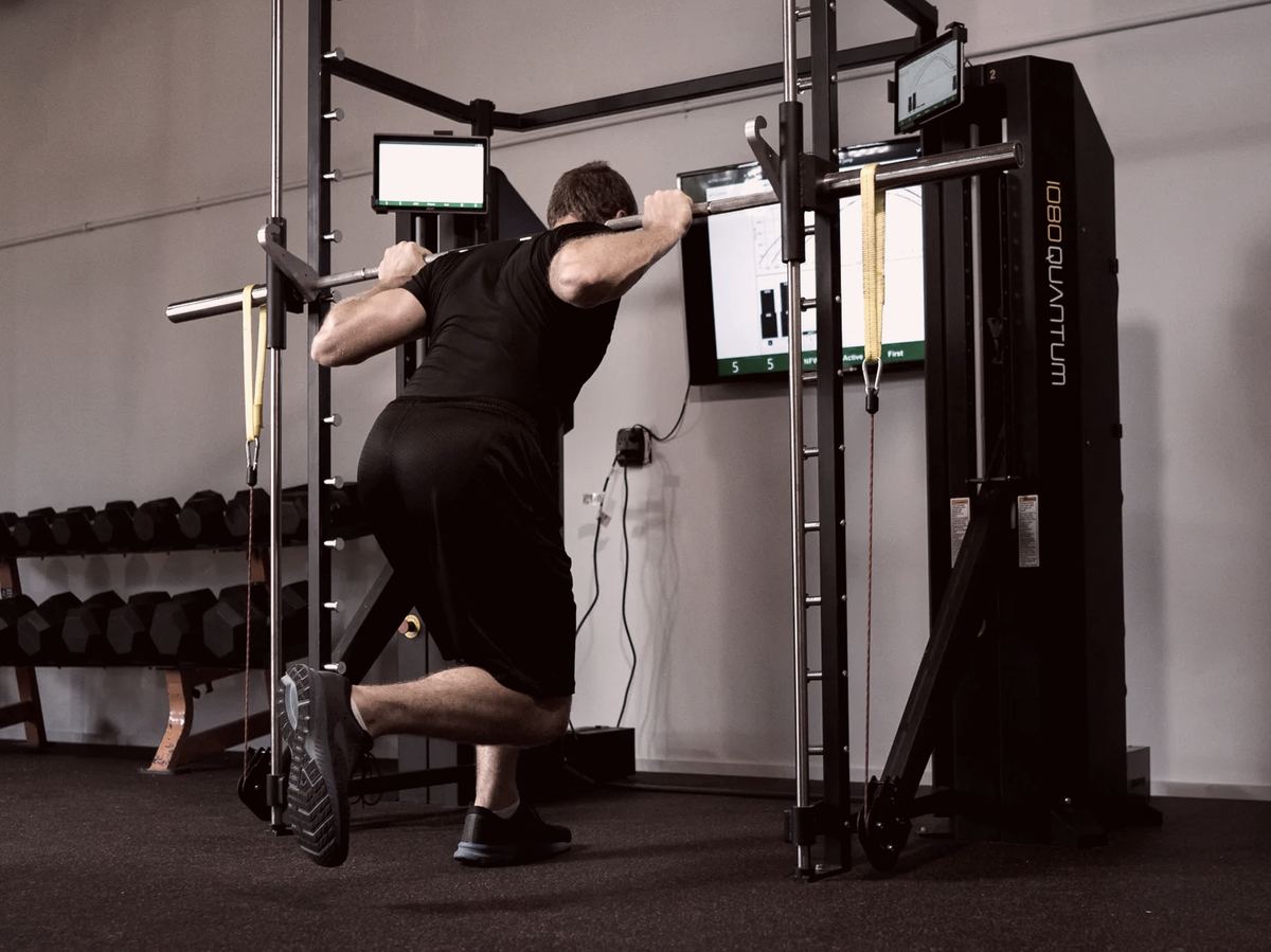 Athlete doing a split squat on the 1080 Quantum at iTOP Recovery Lubbock