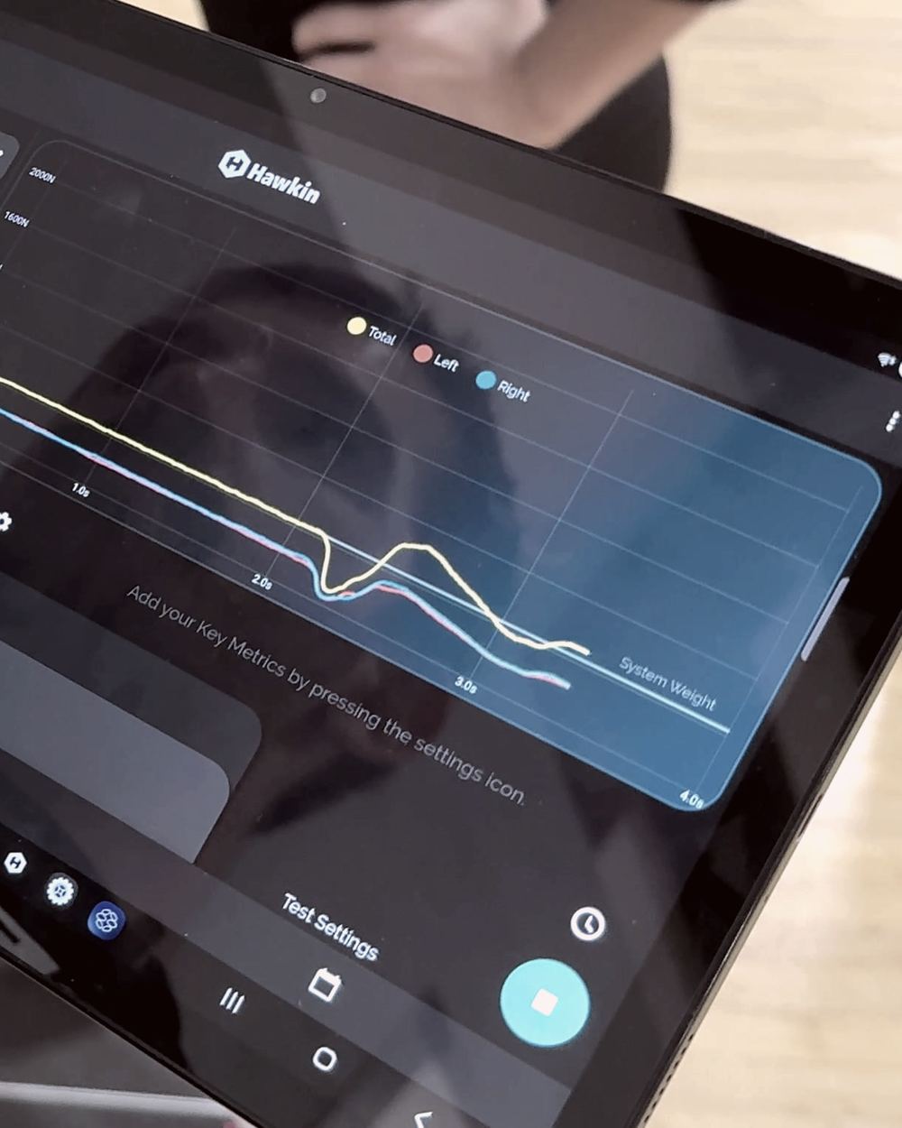 Live Hawkin Dynamics force trace on a clinician's tablet during a jump test