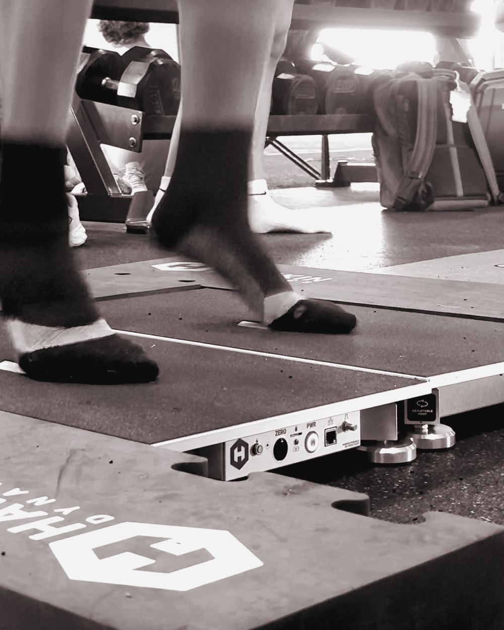 Athletes' feet on Hawkin Dynamics force plates during a jump test