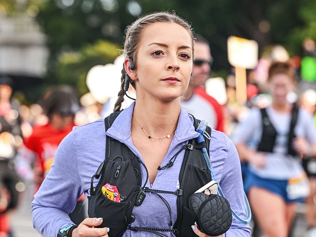 Runner in a hydration vest during a road race