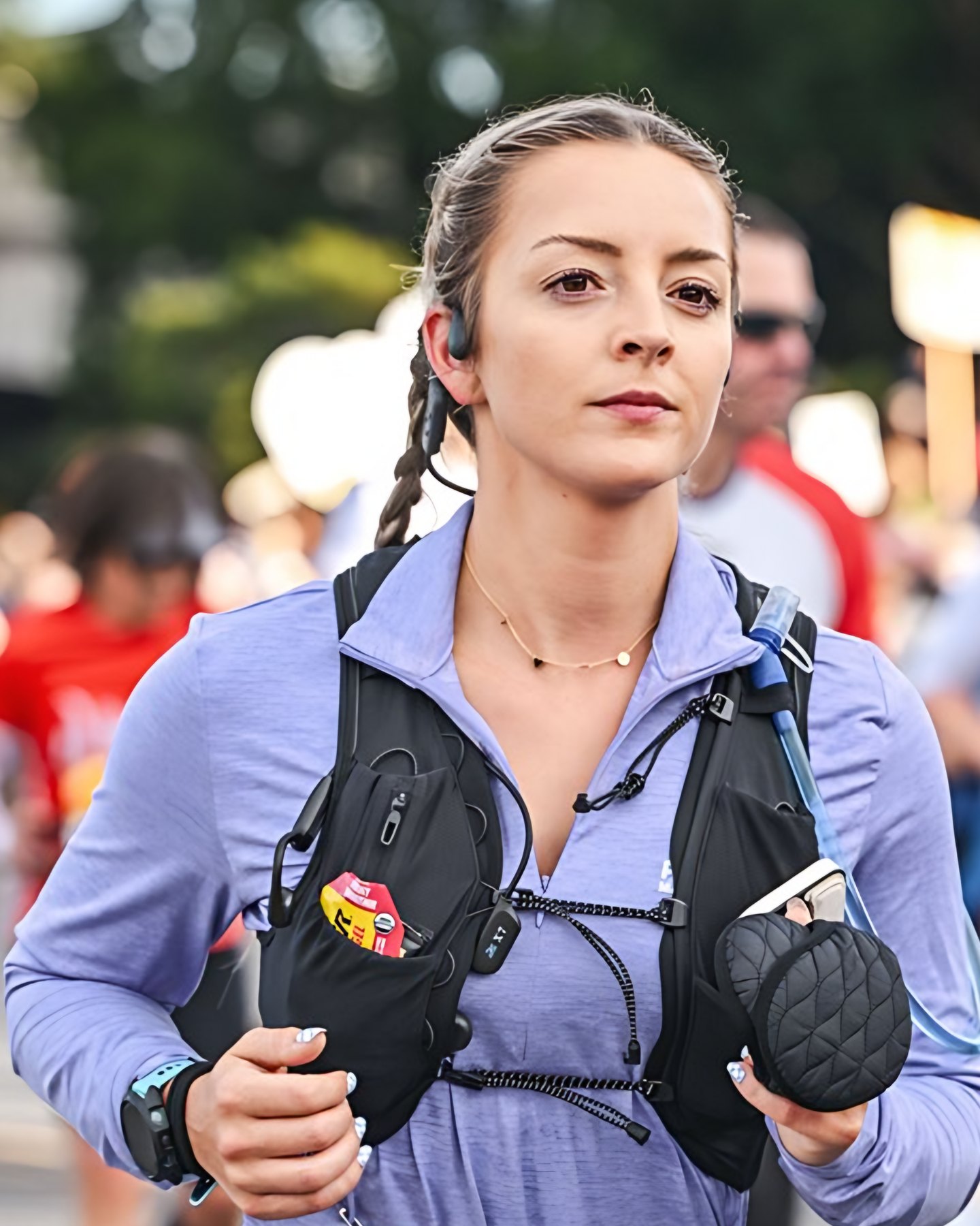 Runner in a hydration vest during a road race